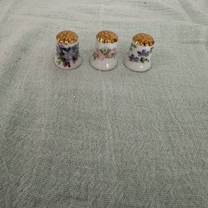 3 Hand painted porcelain thimbles.
